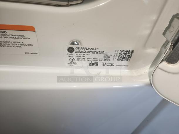 GE® 7.2 cu. ft. Dryer, Model GTD42EASJ2WW, aluminized alloy drum, energy verified, label showing specs and serial info.