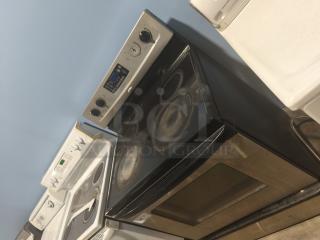 Whirlpool 30" freestanding electric ceramic glass range, model RF362LXSS, in fair condition with visible wear marks.