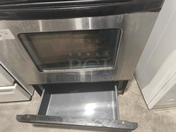 Whirlpool 30" Freestanding Electric Ceramic Glass Range, model RF362LXSS, stainless steel finish, visible wear on surface, storage drawer open.