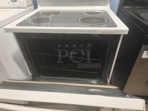 Hotpoint 30" Free-Standing Electric Range, Model RB787WH2WW, features four burners and an open oven door. Used condition.