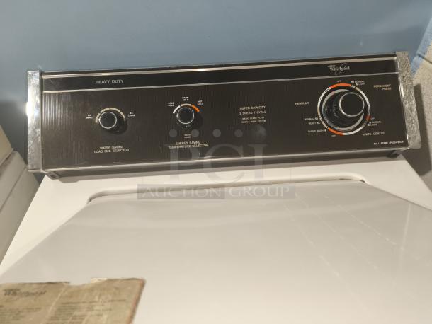 Whirlpool Top-Load Heavy Duty Washer, Model LA5580XTW1, features dials for load size and temperature. Good condition.