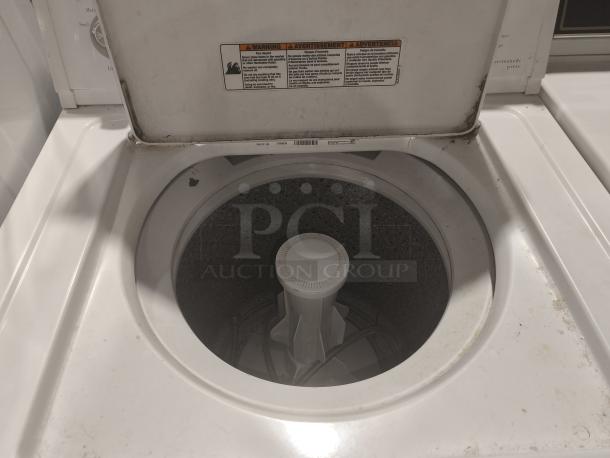 Estate top-load washer, model ETW4100SQ3. Features visible wear and markings. Includes cycle options label.