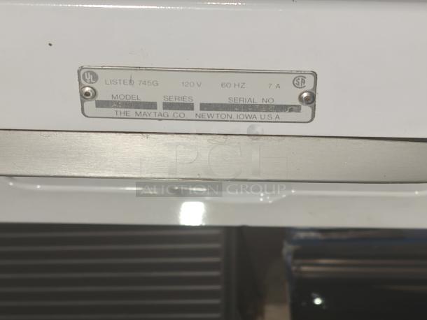 Maytag A511 washer with model tag, 120V, 60Hz, 7A specification, manufactured in Newton, Iowa, USA.