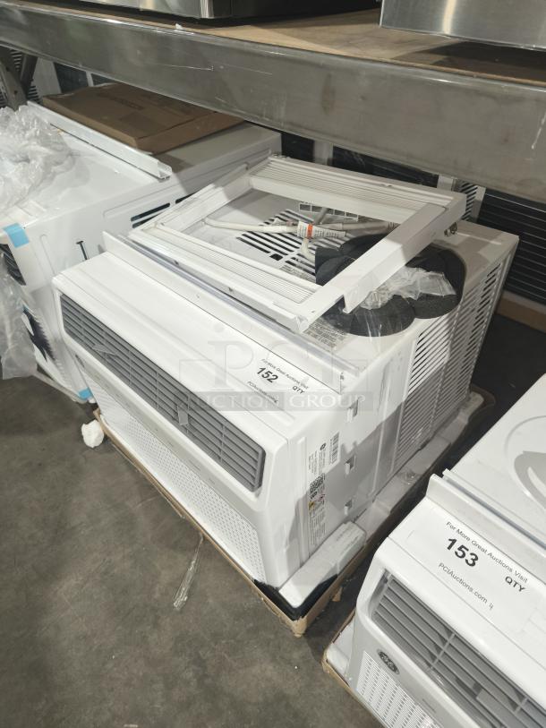 BRAND NEW GE 10,000 BTU Smart Electronic Window Air Conditioner, Model AWFS10WWL, minor scratches and dents visible.