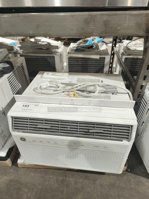 BRAND NEW GE 8,000 BTU window air conditioner, Model AWFS08WWL. Scratch and dent condition, electronic controls visible.