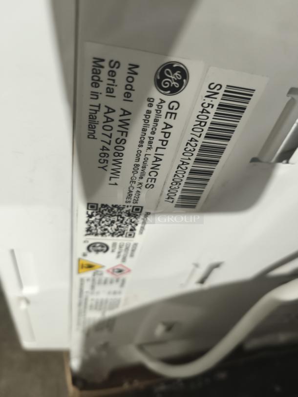 GE 8,000 BTU Smart Electronic Window Air Conditioner, Model AWFS08WWL, new with scratches. Serial AA077465Y, made in Thailand.