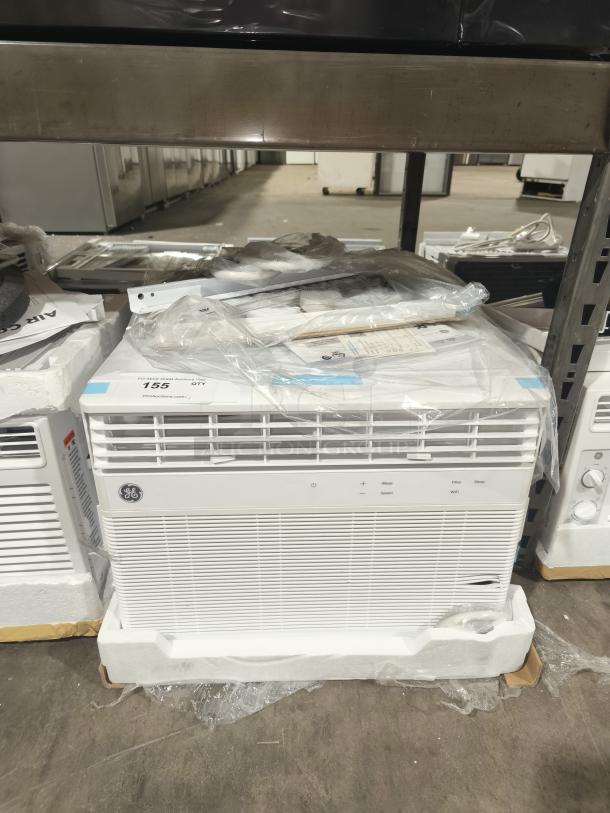 Brand new GE Smart Electronic Window Air Conditioner, model AWFS14WWL, 14,000 BTU, scratch and dent, wrapped in packaging.
