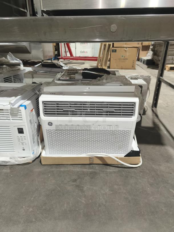 Brand new GE Smart Window Air Conditioner, model AWFS14WWL1, 14,000 BTU, slight scratches, on warehouse floor.