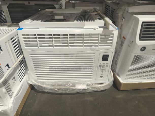 Brand new GE Zoneline 6,000 BTU air conditioner model AHQ06LYCQ1. Scratch and dent condition. Electronic controls shown.