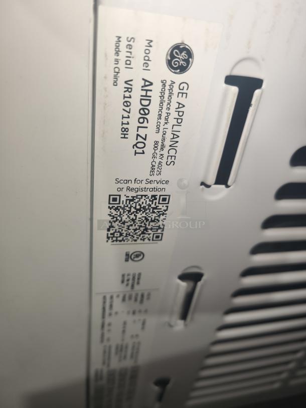 GE 6,200 BTU window air conditioner, model AHD06LZQ1. Brand new, scratch and dent. Tag includes model and serial number.