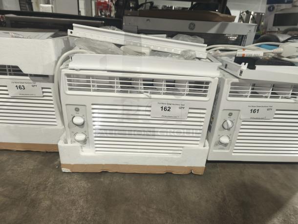 BRAND NEW GE 5000 BTU Mechanical Window Air Conditioner, Model AWFS05BWL, for small rooms. Scratch and dent condition.