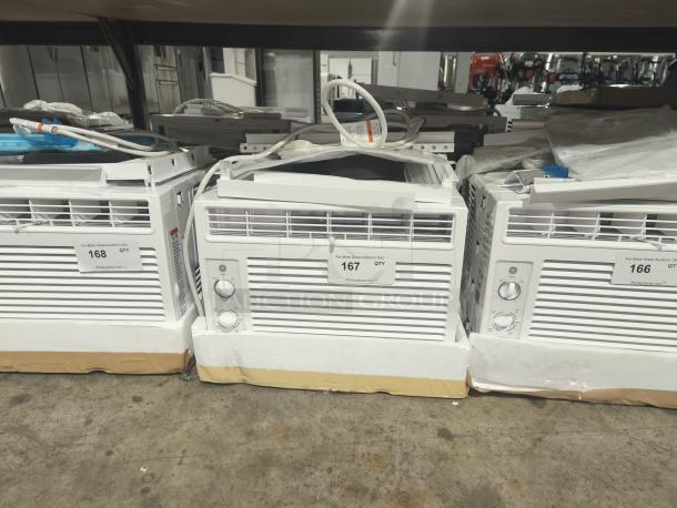 BRAND NEW SCRATCH AND DENT - GE AWFS05BWL 5000 BTU Mechanical Window Air Conditioner for small rooms, packaged, visible labels.