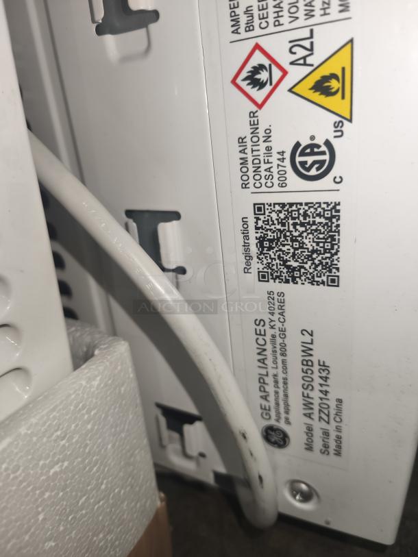 Brand new GE 5000 BTU window air conditioner, model AWFS05BWL, for rooms up to 150 sq ft; scratch and dent condition.