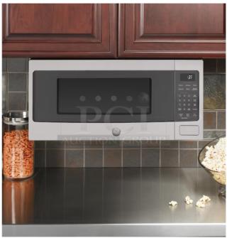 BRAND NEW SCRATCH AND DENT GE Profile 1.1 cu ft Countertop Microwave Oven, Model PEM31SFSS, shown installed under cabinet.
