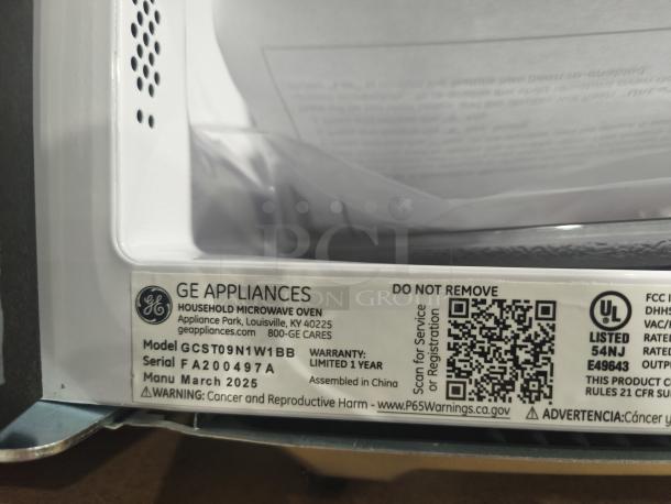 GE 1.1 Cu. Ft. Countertop Microwave, Model GCST09N1W1BB, new scratch and dent, tags: serial F200497A, warranty 1 year.