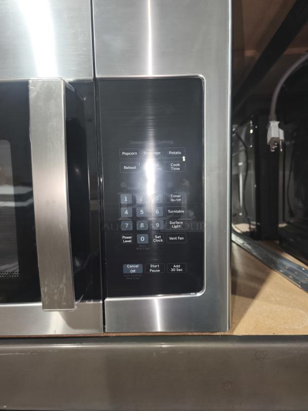 GE 1.6 cu. ft. Over-the-Range Microwave, model JNM3163RJ6SS, new with minor scratches, stainless steel, keypad display.