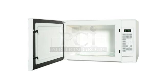BRAND NEW GE 1.1 Cu. Ft. Countertop Microwave Oven, Model GCST11N1WWW, open door view, white, scratch and dent condition.