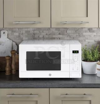 BRAND NEW GE 1.6 cu. ft. countertop microwave, model GCST16S1WWW, white finish, minor scratch and dent. Digital display and controls.