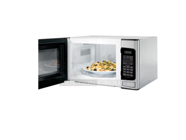 BRAND NEW GE 1.1 Cu. Ft. Countertop Microwave, model GCST11N1WSS, stainless with some scratches. Door open, showing inside.