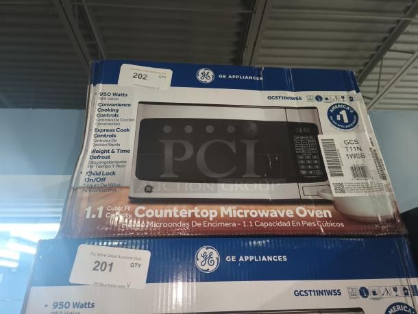 Brand new GE 1.1 Cu. Ft. Countertop Microwave, Model GCST11N1WSS, 950 watts, with express cook/control features. Slight box damage.