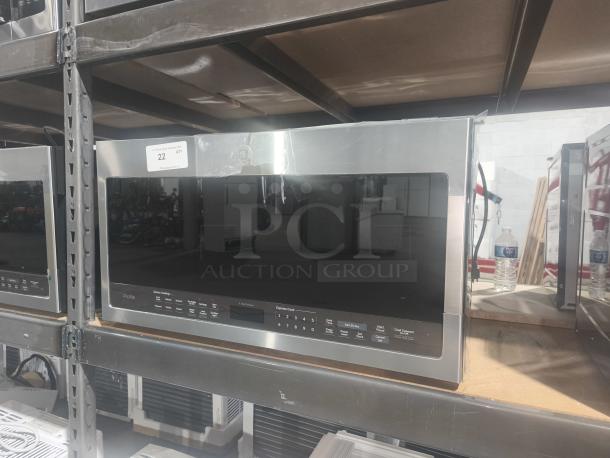 BRAND NEW SCRATCH AND DENT GE Profile 2.1 cu ft Over-the-Range Sensor Microwave Oven, Model PVM9005SJ8SS, in stainless steel.