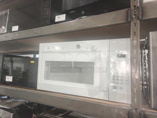 NEW GE 1.6 cu ft Over-the-Range Microwave, model JVM3160DF9WW, in pristine condition, features white exterior, digital controls.