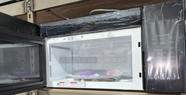 BRAND NEW GE 1.6 cu ft Over-the-Range Microwave Oven, model JVM3160DFBB, still in protective wrapping. Scratch and dent condition.