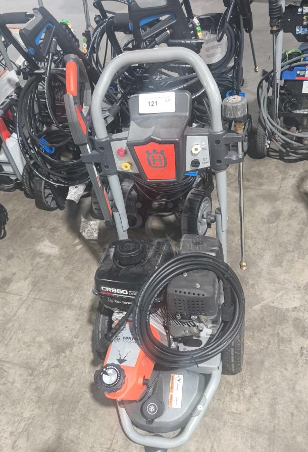 Husqvarna PW-3200 gas pressure washer, model 022007, 3200 PSI, tested and working; includes visible controls and hose.