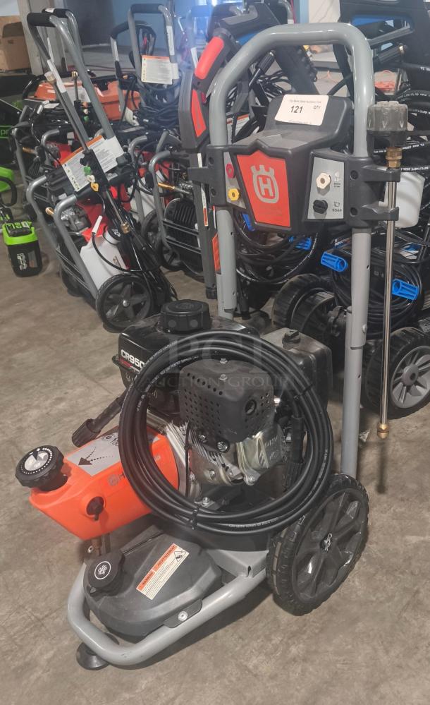 Husqvarna PW-3200 pressure washer, model 022007, 3200 PSI, gas-powered, tested and working, visible brand logo.