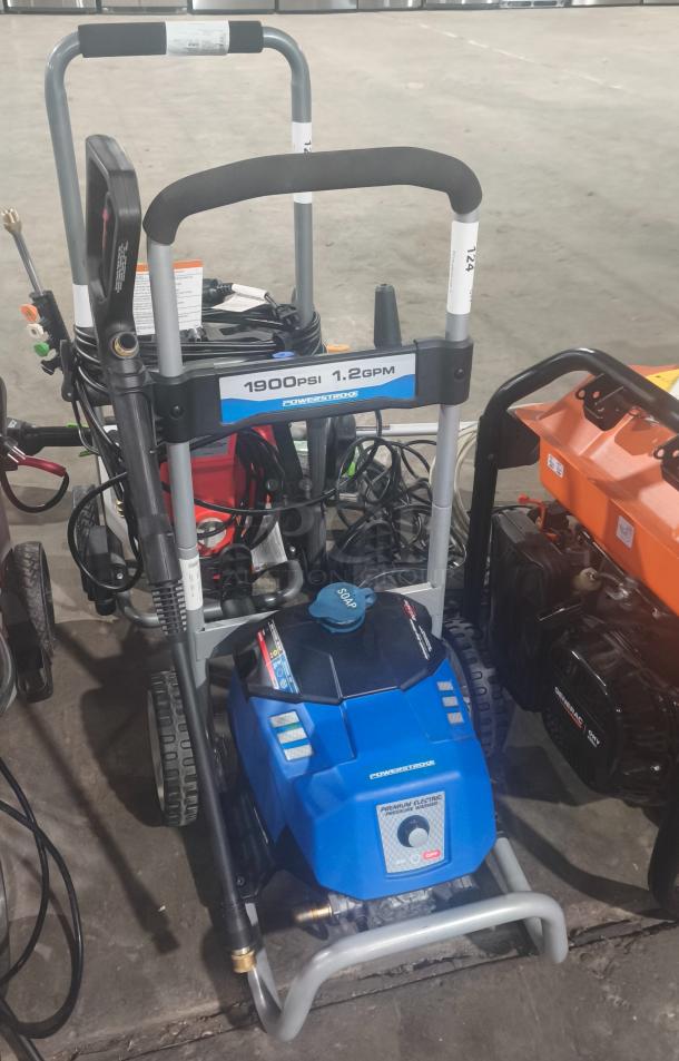 PowerStroke PS141913 pressure washer, 1900 PSI, 1.2 GPM, tested and working. Features soap dispenser, sturdy wheels, good condition.