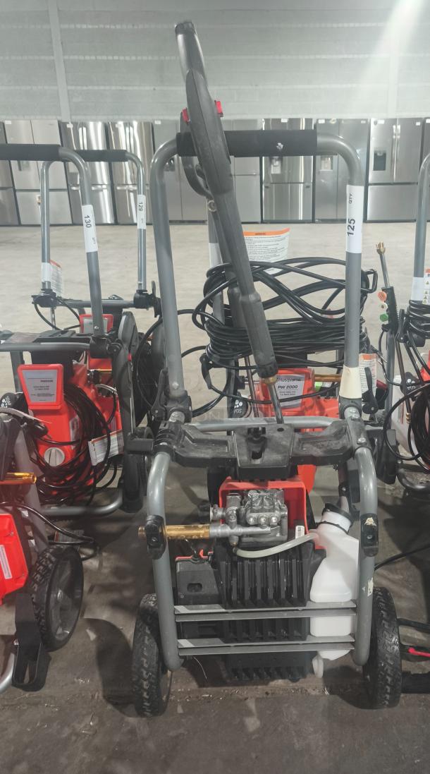 Husqvarna PW2300 Electric Pressure Washer, tested and working. Visible sturdy frame, hose reel, and operational panel.
