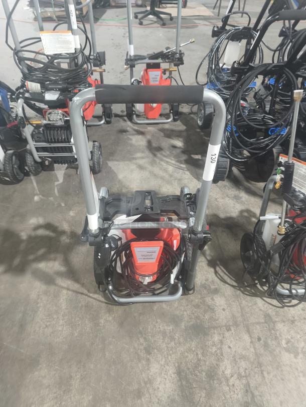 Husqvarna PW2300 Electric Pressure Washer, tested and working, with sturdy frame, coiled hose, and visible control panel.