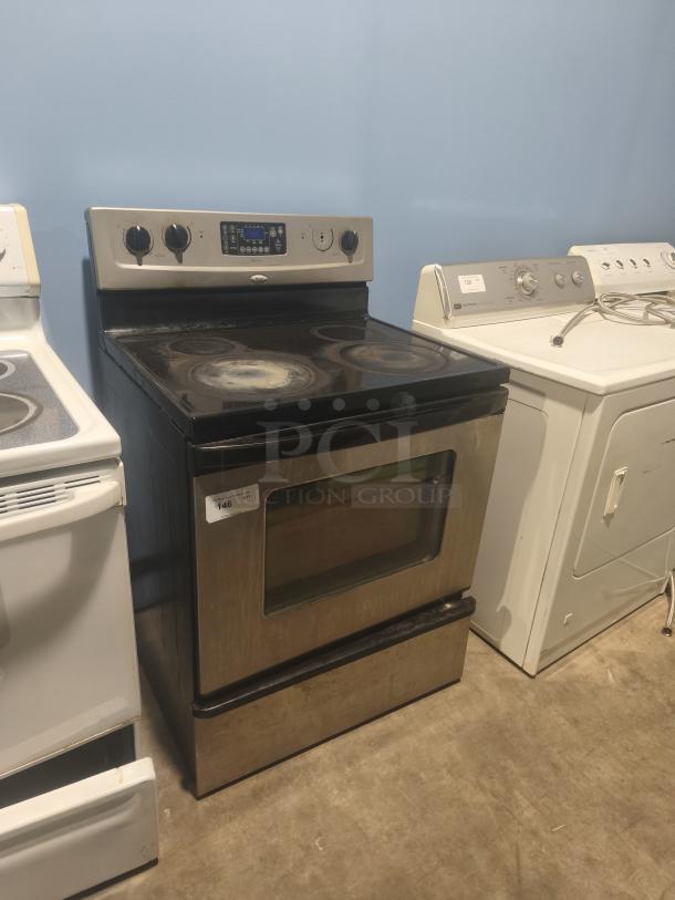 Whirlpool 30" Freestanding Electric Range, Model RF362LXSS. Ceramic glass top, stainless steel. Shows signs of use.