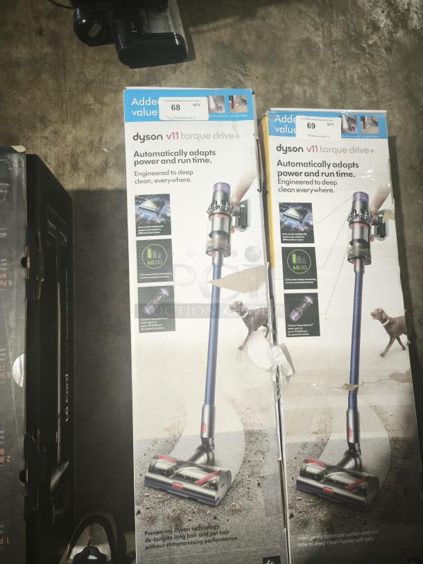 Dyson V11 Torque Drive cordless stick vacuum in original packaging, new condition. Features automatic power adjustment and LCD display.
