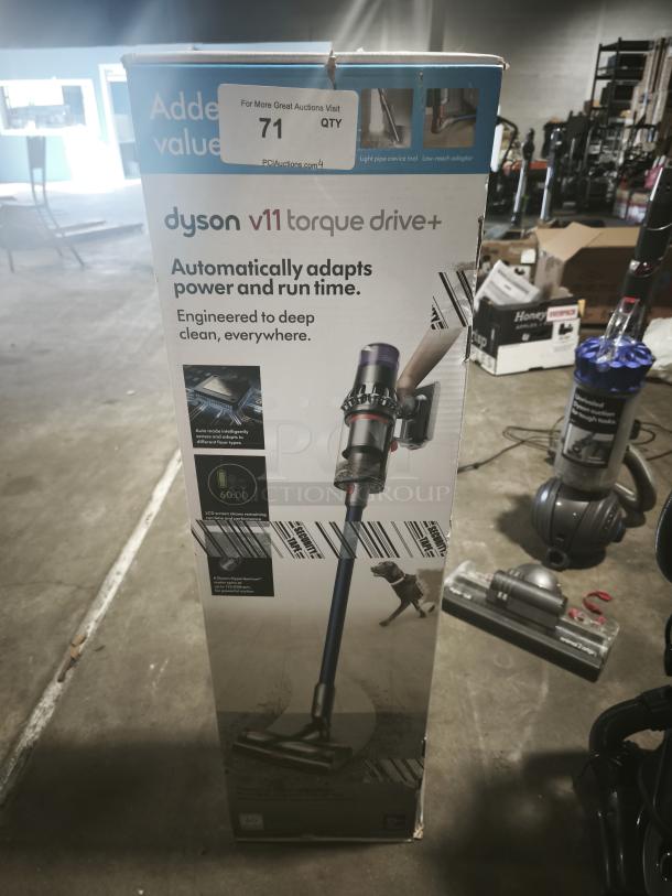 Dyson V11 Torque Drive PLUS cordless vacuum, new in box, features automatic power adaptation, 60-minute runtime.