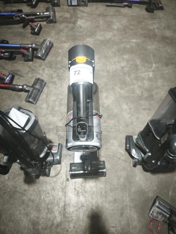 LG CordZero A9 Cordless Stick Vacuum, Model A916BM, tested and working, gray finish, auction tag visible.