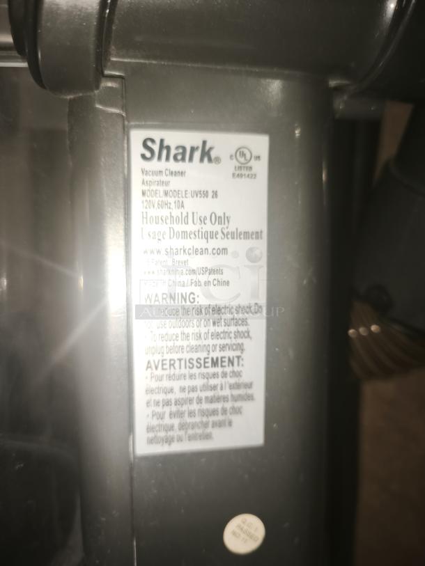 Shark UV550 Lift-Away XL Upright Vacuum, tested working, label shows model details and safety warnings, good condition.