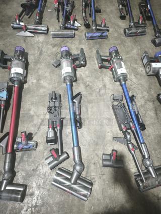 Dyson V11 Torque Drive PLUS cordless stick vacuums, tested and working, in good condition, visible model labels.