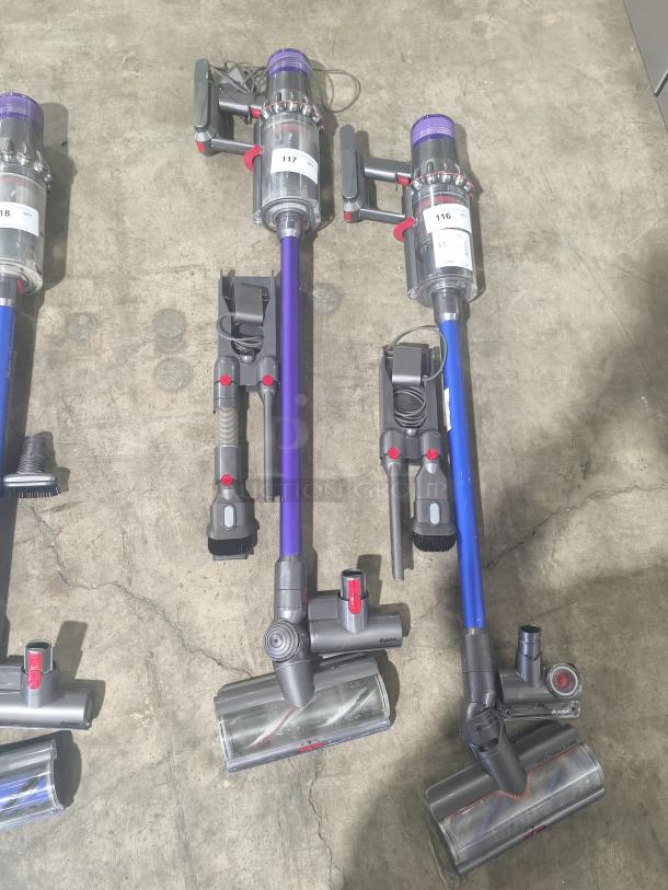 Dyson V11 Torque Drive PLUS cordless stick vacuum, tested and working, includes attachments, labels show numbers 116 and 117.