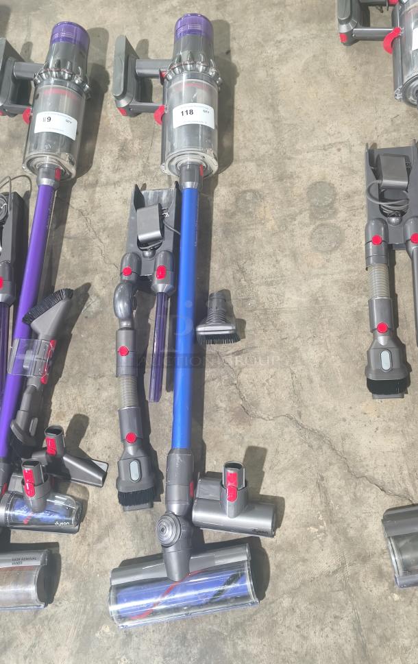 Dyson V11 Torque Drive PLUS cordless vacuum, tested and working, includes multiple attachments, label indicates item 118.
