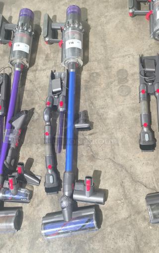 Dyson V11 Torque Drive PLUS cordless vacuum, tested and working, includes multiple attachments, label indicates item 118.