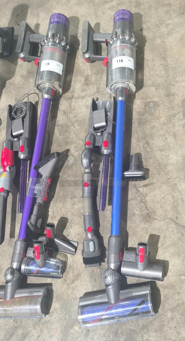 Dyson V11 Torque Drive PLUS cordless vacuum, tested and working, includes attachments, model label visible, excellent condition.