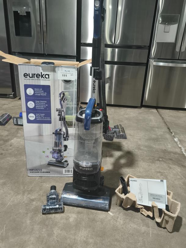 Eureka NEU653 FlexReach Upright Vacuum with Quick-Lift, shown with box, accessories, and manual; tested and working condition.