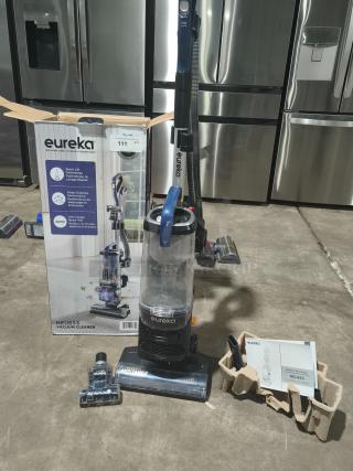 Eureka NEU653 FlexReach Upright Vacuum with Quick-Lift, shown with box, accessories, and manual; tested and working condition.