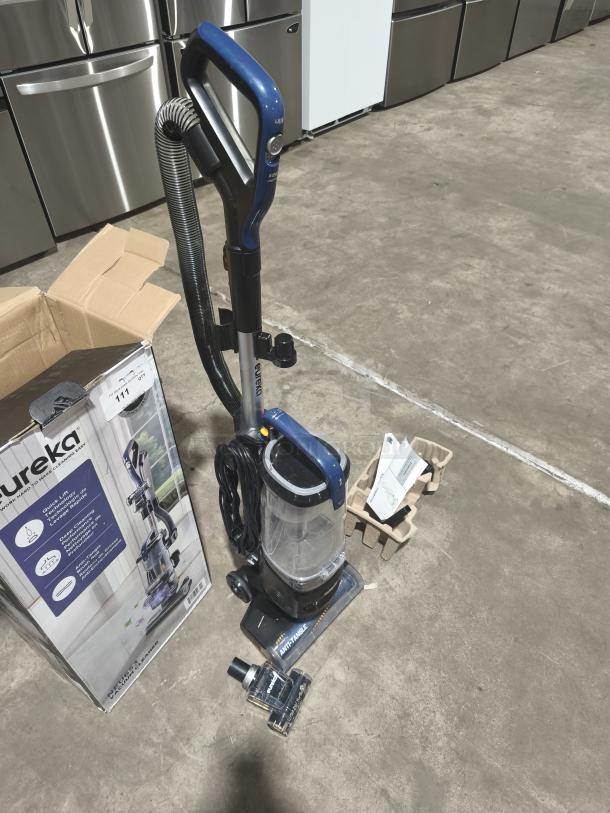 Eureka FlexReach NEU653 upright vacuum cleaner with Quick-Lift, tested and working, includes attachments and original packaging.