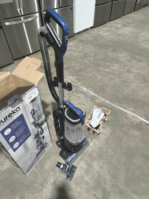 Eureka NEU653 FlexReach Upright Vacuum Cleaner with Quick-Lift Technology, tested and working. Includes original box and accessories.