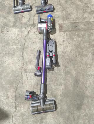 Dyson V11 Torque Drive PLUS cordless stick vacuum, tested and working, includes attachments, in good condition.