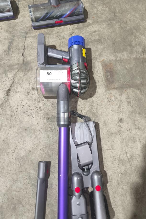 Dyson V11 Torque Drive PLUS cordless vacuum, tested and working. Includes main unit, wand, and cleaning head. Condition: good.