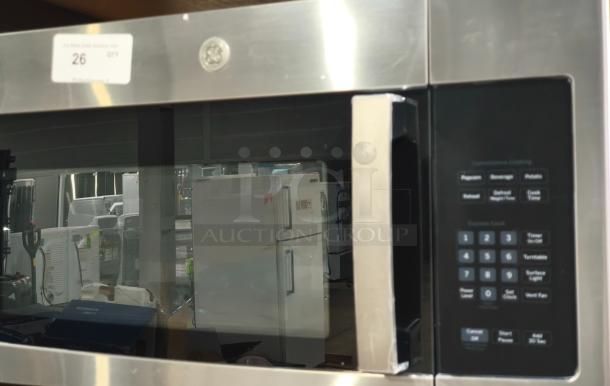 BRAND NEW SCRATCH AND DENT GE Over-the-Range Microwave, 1.6 cu ft, Model PVM9005SJ8SS. Stainless steel. Control panel visible.