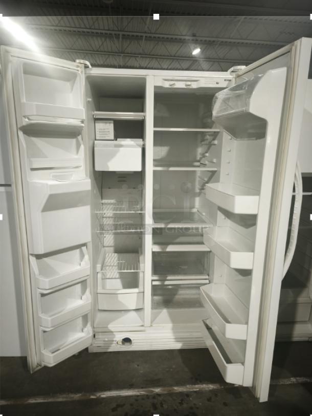 Kenmore model 10657362700 refrigerator, white, side-by-side doors open to reveal shelving and storage bins, clean interior.